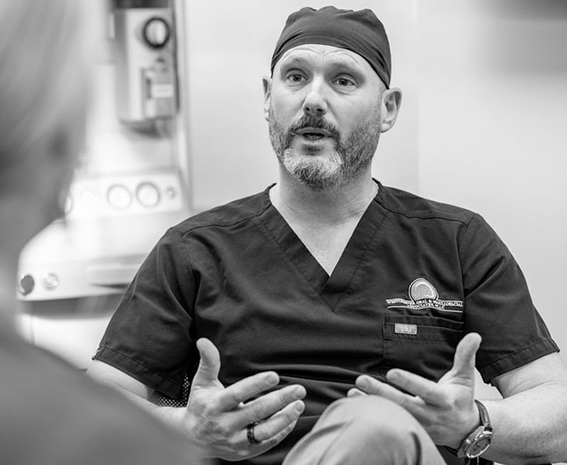 Dr. Kur speaking with patient